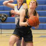 Forks Keira Johnson looks for the hoop as Crescents Kaylen Mason defends in Joyce in late December. Johnson made the Pacific 2B League first team. (Keith Thorpe/Peninsula Daily News)