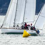 The schooner Sir Isaac rounds a marker with the sloop Underdog on its stern during the 32nd annual Shipwrights Regatta on Port Townsend Bay on Saturday. Twenty-two sailboats were on the water for the noon start. The regatta, hosted by the Port Townsend Sailing Association and supported by the Northwest Maritime Center, marks the beginning of the sailboat racing season in Port Townsend. (Steve Mullensky/for Peninsula Daily News)