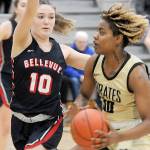 Keith Thorpe/Peninsula Daily News
Peninsula's Chasity Selden, right, drives to the lane as Bellevue's Jadyn Mueller runs interference on Wednesday night in Port Angeles.