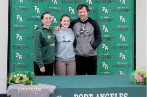 Port Angeles' Lily Halberg signed a letter of intent last week to play volleyball at Eastern Oregon University in La Grande, Ore., last week. With her at her signing is her mother, Christine Grunch-Halberg and father Greg Halberg. (Courtesy photo)