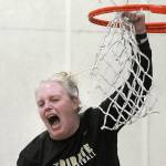 Keith Thorpe/Peninsula Daily News
Peninsula Pirates head coach Ali Crumb emits a scream of excitement as she cuts down the net after her team clinched the NWAC North Region championship by defeating Everett on Wednesday in Port Angeles