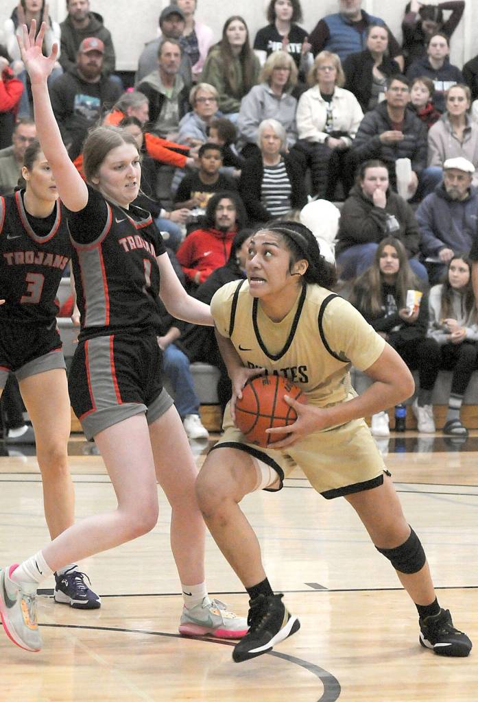 Peninsulas Ituau Tuisaula, right, heads for the paint as Everetts Lilly Frunk tries to hold her off on Wednesday night in Port Angeles. (Keith Thorpe/Peninsula Daily News)