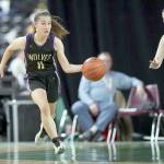 David Willoughby/for Peninsula Daily News Sequims Taryn Johnson scans up the court during the Wolves Class 2A state quarterfinal at the Yakima SunDome on Thursday night.