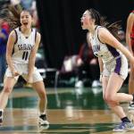 Sequim's Taryn Johnson and Hannah Bates celebrate Bates' game-winning shot against Othello on Saturday morning. Sequim finished fourth at the state 2A girls basketball tournament in Yakima. (David Willoughby/for Peninsula Daily News)
