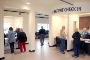 Visitors to the North Olympic Healthcare Networks new Eastside Clinic look around the entry lobby during an open house on Friday in Port Angeles. (Keith Thorpe/Peninsula Daily News)