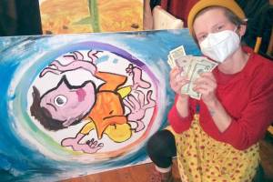 Sarah Tucker 
The 2022 winner, Otto Younker, is pictured with her creation and prize.