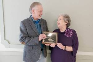 Pictured is David Whitney, ECHHO board chair, presenting the award to Gormly.