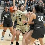 Peninsulas Ituau Tuisaula, center, looks to pass surrounded by Shoreline defenders, including, from left, Leiah Naeata, Taylor Eldredge and Moemanogi Notoa on Saturday in Port Angeles. (Keith Thorpe/Peninsula Daily News)