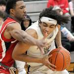KEITH THORPE/PENINSULA DAILY NEWS
Peninsula's Roosevelt Williams Jr., right, shoulders his way past Skagit Valley's Omari Maulana during Wednesday's North Division game at Peninsula College.