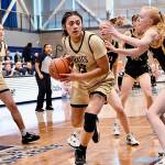 Jay Cline/for Peninsula College Peninsulas Ituau Tuisaula works down low while guarded by a Walla Walla defender during the Pirates NWAC Womens Basketball Tournament Quarterfinal on Friday at Columbia Basin College in Pasco.