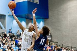 Peninsula Colleges Roosevelt Williams Jr. goes up for a layup around Columbia Basins TaVeus Randle on Saturday in the NWAC tournament held in Pasco. Peninsula lost 77-73. (Jay Cline/Peninsula College)