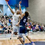 Peninsula Colleges Roosevelt Williams Jr. goes up for a layup around Columbia Basins TaVeus Randle on Saturday in the NWAC tournament held in Pasco. Peninsula lost 77-73. (Jay Cline/Peninsula College)