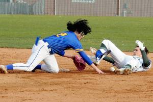 KEITH THORPE/PENINSULA DAILY NEWS
Port Angeles' Alex Angevine, right, looks back after sliding into second as Bremerton shortstop Brian Infante lets the ball get past him, allioing Angevine to scramble to the bag in the second inning on Tuesday at Port Angeles Civic Field.