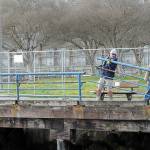 KEITH THORPE/PENINSULA DAILY NEWS
Brian Tucker, left, and Kevin Smith, workers with the Sequim branch of Neely Construction Co., remove a section of rusted railing at Port Angeles City Pier on Thursday.. The project calls for replacement of 1,300 linear feet of pedestrian railings that were installed in the 1970s with corrosion-resistant galvanized steel barriers around the pier and walkways. The project is expected to be completed in June.