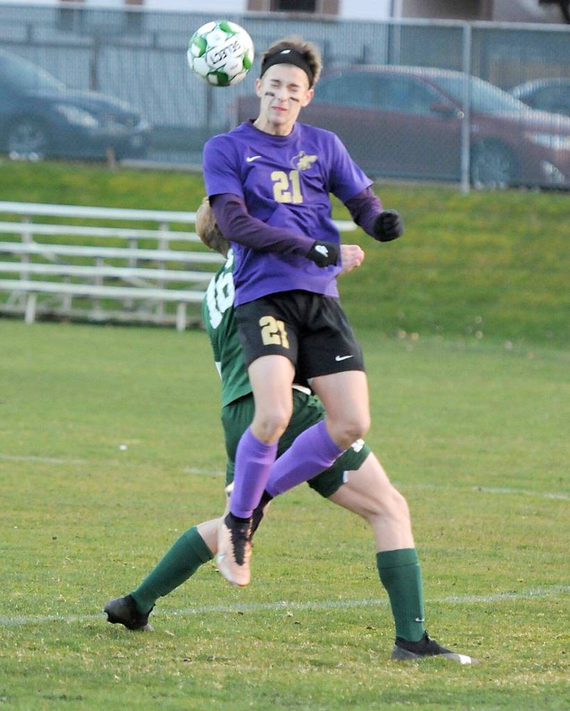 KEITH THORPE/PENINSULA DAILY NEWS Sequims Preston Kurtze take the header over the top of Port Angeles Zak Alton on Thursday in Port Angeles.