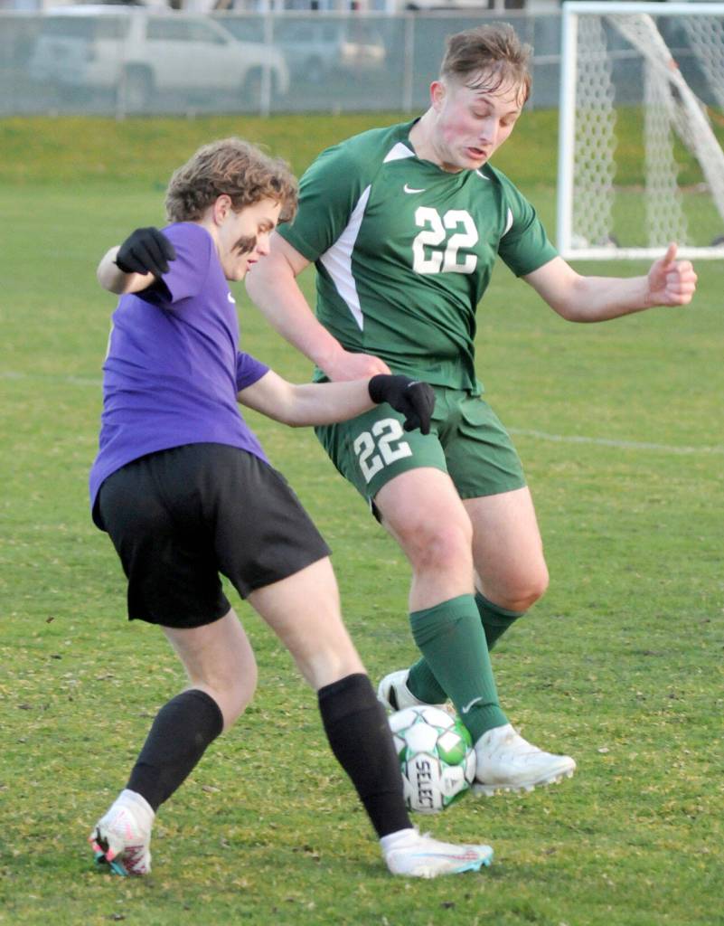 KEITH THORPE/PENINSULA DAILY NEWS Sequims Keaton King, left, and Port Angeles Eli Fischer battle for the ball on Thursday at Port Angeles Civic Field.