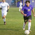 Sequims Adrian Mendez dribbles the ball against Olympic on Tuesday night in Sequim. (Emily Matthiessen/Olympic Peninsula News Group)