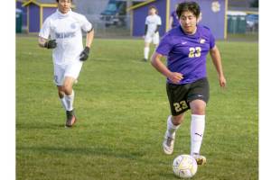 Sequims Adrian Mendez dribbles the ball against Olympic on Tuesday night in Sequim. (Emily Matthiessen/Olympic Peninsula News Group)