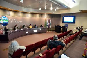 Housing Coordinator Holden Fleming speaks to the Port Angeles City Council at their regular meeting on Tuesday, when new zoning codes were adopted in an effort to bring additional housing to the city. (Peter Segall/Peninsula Daily News)