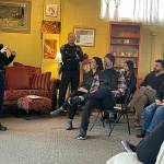 Sequim Police Chief Sheri Crain talks with a crowd at a Sequim Business Merchants meeting. She encouraged people to call police if they see something suspicious. (Matthew Nash/Olympic Peninsula News Group)