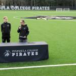Peninsula College soccer coaches Jake Hughes, left, and Kanyon Anderson speak during the official opening of a new pitch surface at the Wally Sigmar Athletic Complex on Wednesday on the schools Port Angeles campus. (Keith Thorpe/Peninsula Daily News)