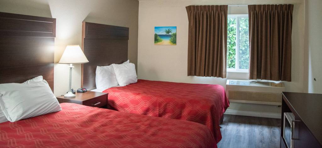 Emily Matthiessen / Olympic Peninsula News Group
A two-queen bedroom at the Ocean Star Inn features original art by Anna Oh, refrigerator, microwave and coffee maker.