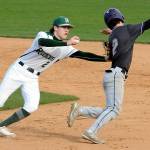 KEITH THORPE/PENINSULA DAILY NEWS
Port Angeles shortstop Alex Angevine, left, tries to tag North Kitsap's Alex Elton in a rundown between first and second during the third inning on Tuesday at Port Angeles Civic Field.