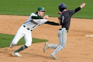 KEITH THORPE/PENINSULA DAILY NEWS
Port Angeles shortstop Alex Angevine, left, tries to tag North Kitsap's Alex Elton in a rundown between first and second during the third inning on Tuesday at Port Angeles Civic Field.