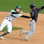 KEITH THORPE/PENINSULA DAILY NEWS Port Angeles shortstop Alex Angevine, left, tries to tag North Kitsaps Alex Elton in a rundown between first and second during the third inning on Tuesday at Port Angeles Civic Field.