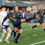 Spartan Jorge Diaz kicks back over his head towards the Forks goal while teammates Brody Owen and DeAnthony Davila (8) look on. Also in the action are Elmas Matthew Wood (9) and Theo Flores (10). Photo by Lonnie Archibald.