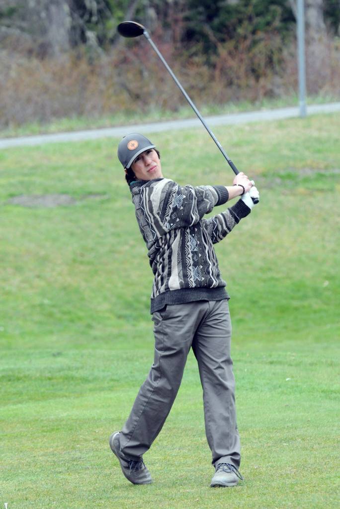 KEITH THORPE/PENINSULA DAILY NEWS Port Angeles Phoenix Flores tees off on the first hole at Peninsula Golf Course in Port Angeles on Thursday.