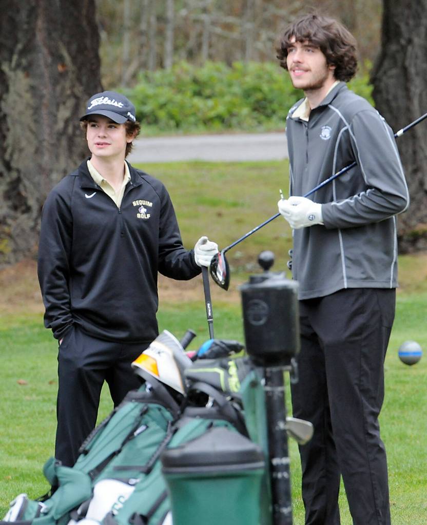 KEITH THORPE/PENINSULA DAILY NEWS Sequims Carter Cronin, left, and Cole Smithson wait to tee-off on the first hole at Peninsula Golf Course on Thursday in Port Angeles.