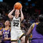 Iowa's Caitlin Clark shoots past LSU's Last-Tear Poa during the first half of the NCAA Women's Final Four championship basketball game Sunday, April 2, 2023, in Dallas. (AP Photo/Darron Cummings)