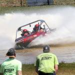 Keith Thorpe/Peninsula Daily News
The Fear Not sprint boat driven by Clint Birch and navigated by Terri Lovell speeds through the Extreme Sports Park course as a pair of "island hopper" safety crew members watch the action on Saturday in Port Angeles.