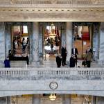 Lawmakers gather outside the State Reception Room on the second floor of the state Capitol. The legislative session ends April 23. (Paul Gottlieb/for Peninsula Daily News)