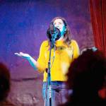 Elizar Mercado Nessa Goldman, host of the Out Loud Story Slam, tells a story at The Jewel Box Theatre in Poulsbo.