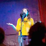 Elizar Mercado Nessa Goldman, host of the Out Loud Story Slam, tells a story at The Jewel Box Theatre in Poulsbo.