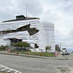 The post office building in Port Townsend, covered with protective plastic while undergoing renovation work, is buffeted by gale force winds on Sunday strong enough to rip the covering. (Steve Mullensky/for Peninsula Daily News)
