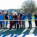 Steve Mullensky/for Peninsula Daily News


Port Townsend city council member, Monica Mick-Hagger and Port Townsend Pickleball Club president Lynn Pierle (cq) cut the ribbon to dedicate the Mountain View Pickleball courts to the City of Port Townsend in a ribbon cutting on Wednesday at the club. Others looking on are members of the club board of directors and city manager John Mauro, holding the microphone, Carrie Hite, Director of Parks and Recreation strategy, holding the ribbon and to her left is director of parks facilities, Michael Todd. The club now has 219 members on the roster.