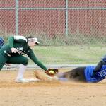 Port Angeles third baseman Taylor Worthington, left, tags out North Masons Adrianna Crowley to end the top of the fourth inning on Saturday at Dry Creek Elementary in Port Angeles. (Keith Thorpe/Peninsula Daily News)
