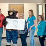 Pictured, left to right, are Carmen Geyer, Jeff Lunt, Smokey T. Bear, Linda Skolnik, Sarah Schaefermeyer, Darlene Martin and Jane Marks.