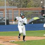 Port Angeles batter Luke Flodstrom, center, lays down a sacrafice bunt to drive in teammate Ezra Townsend, right, while North Mason catcher Cole McCormick looks on helplessly during the second inning of Tuesdays game at Port Angeles Civic Field. (Keith Thorpe/Peninsula Daily News)