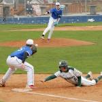 Port Angeles Brian Guttormson, right, dives back to first during a pickoff attempt from North Mason pitcher Nolan McGanney to first baseman Kingston Serebryakov on Tuesday in Port Angeles. (Keith Thorpe/Peninsula Daily News)