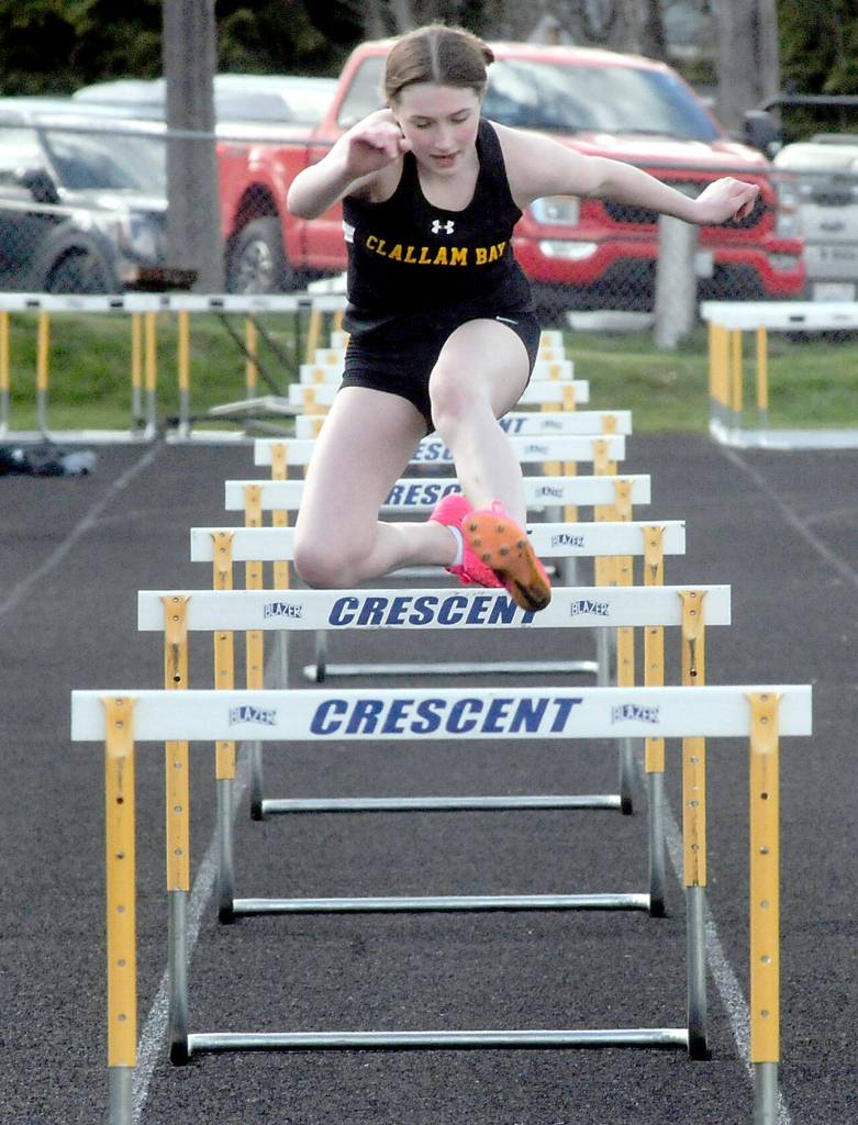 Kyleigh Richardson of Clallam Bay runs as the sole competitor in the girls hurdles on Wednesday at Crescent High School. (Keith Thorpe/Peninsula Daily News)