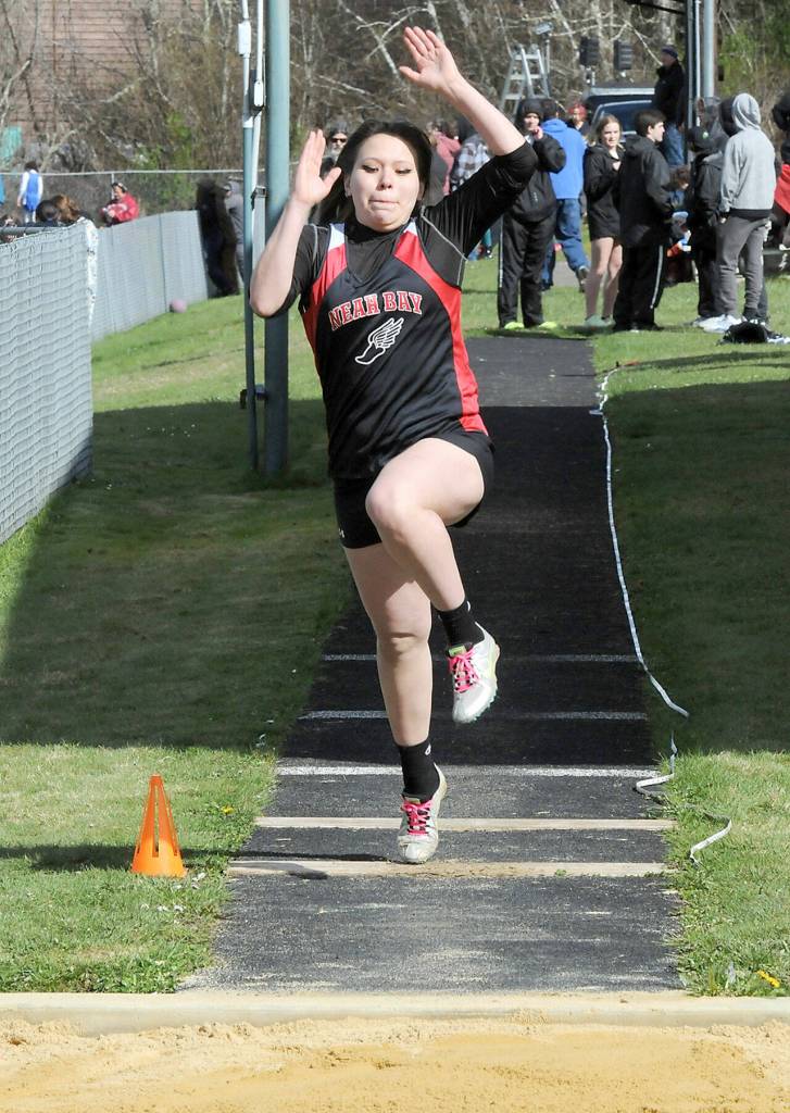 Neah Bays Mariella Wakole takes flight in the girls long jump on Wednesday in Joyce. (Keith Thorpe/Peninsula Daily News)