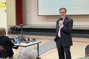 Port Angeles School District Superintendent Marty Brewer addresses the audience at a public forum at Jefferson Elementary School. (Paula Hunt/Peninsula Daily News)