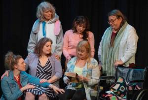 Front, from left to right, Merrin Packer, Taryn Dupont, Cheryl DiPietro and, behind, Cheryl Tamblyn, Jamie Pauley and Amy Henry participate in a poignant scene in Calendar Girls, Olympic Theatre Arts newest production. (Emily Matthiessen/Olympic Peninsula News Group)