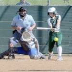 KEITH THORPE/PENINSULA DAILY NEWS
Port Angeles' Kennedy Rognlien swings for a triple in the third inning as Olympic catcher Beya Richmond waits for the delivery from pitcher Brenda Morrison on Thursday at Dry Creek Elementary in Port Angeles.