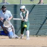 KEITH THORPE/PENINSULA DAILY NEWS Port Angeles Kennedy Rognlien swings in the third inning as Olympic catcher Beya Richmond waits for the delivery from pitcher Brenda Morrison on Thursday at Dry Creek Elementary in Port Angeles.