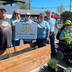 At Sequim Food Bank, volunteers, from left, Kevin Wilson, Betty Gwaltyney, Corky Schadler, Melody Wilson, John Matson and Melissa Vemi with Sequim Community Church, worked together to build two planters, fill them with dirt and plant lavender for Sequim Beautiful Day. Not pictured was Steve Gale. (Matthew Nash/Olympic Peninsula News Group)